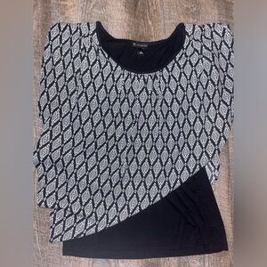 Back and white blouse.